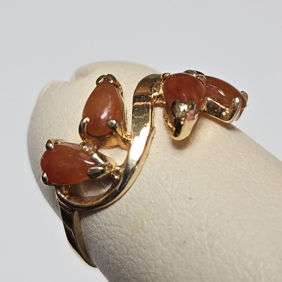 14K gold ring with pear-shaped jade gemstone, weighing 1.6 grams, featuring elegant jewelry craftsmanship.