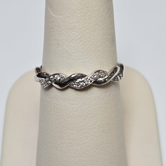 10K white gold ring with 0.25ct round diamonds, sleek jewelry design by Chique Jewelry, showcasing the sparkling gemstone.