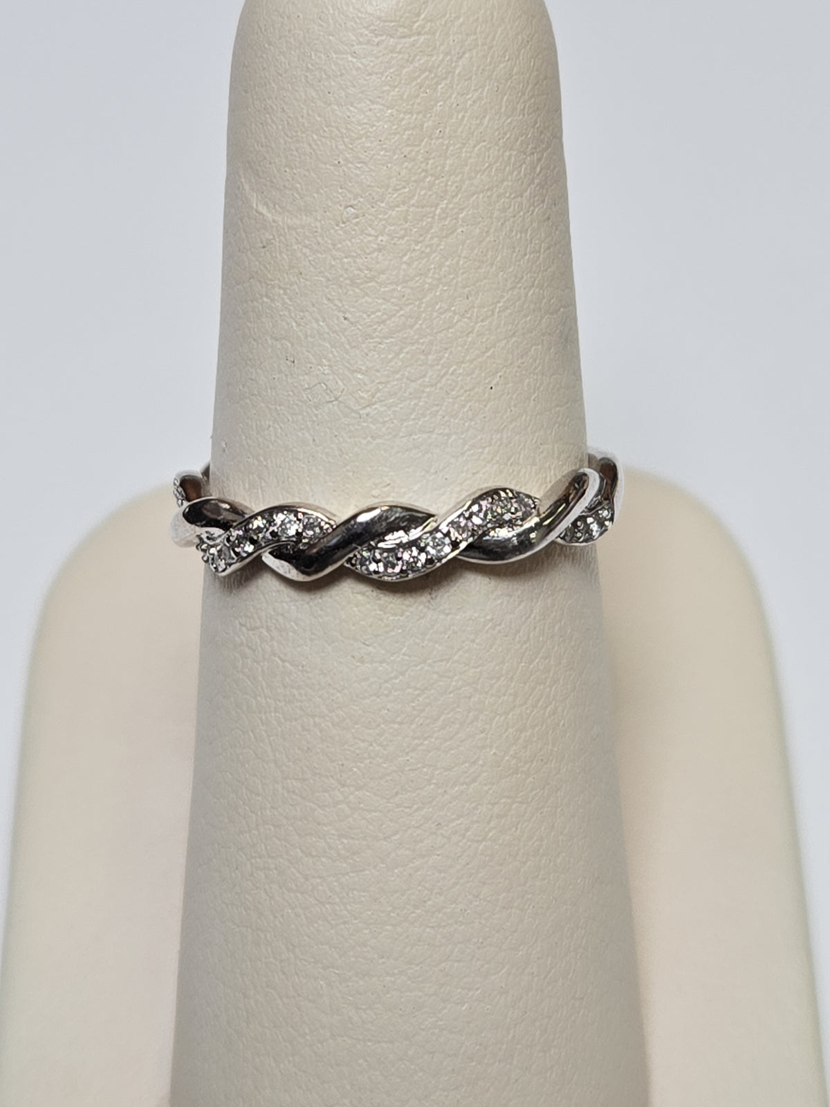 10K white gold ring with 0.25ct round diamonds, sleek jewelry design by Chique Jewelry, showcasing the sparkling gemstone.