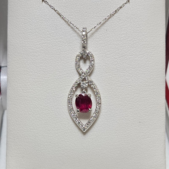 14K white gold pendant featuring a 1.15ct oval ruby, elegant jewelry piece by Chique Jewelry, showcasing fine craftsmanship.