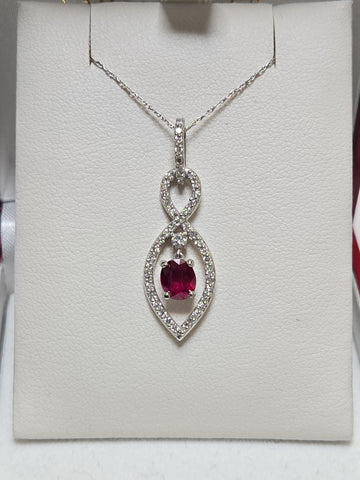 14K white gold pendant featuring a 1.15ct oval ruby, elegant jewelry piece by Chique Jewelry, showcasing fine craftsmanship.