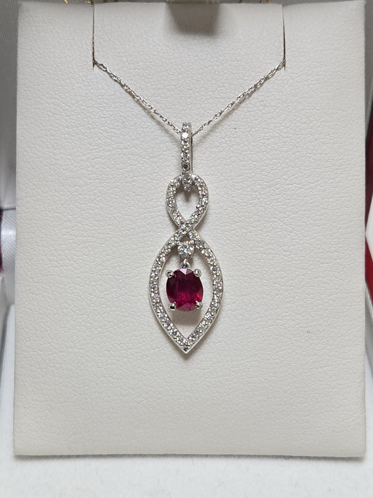 14K white gold pendant featuring a 1.15ct oval ruby, elegant jewelry piece by Chique Jewelry, showcasing fine craftsmanship.