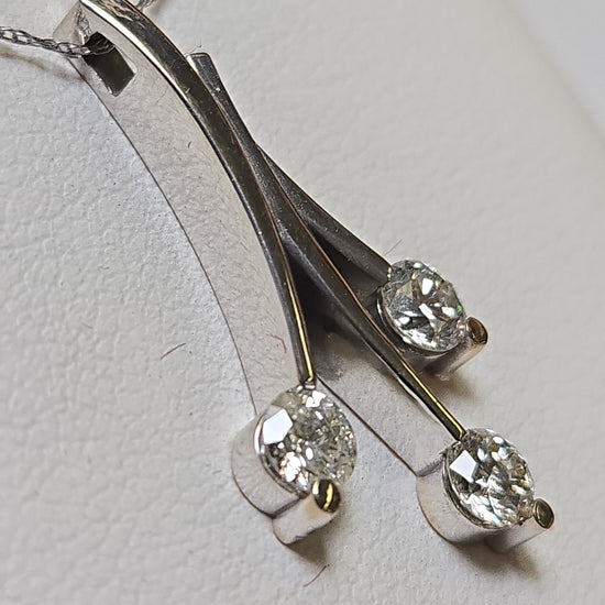 14K white gold pendant with 0.83ct round diamonds, crafted by Chique Jewelry, featuring a elegant and sparkling design.