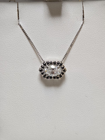 14K white gold pendant with 0.72ct oval lab-created diamond, showcasing elegant jewelry design and craftsmanship.
