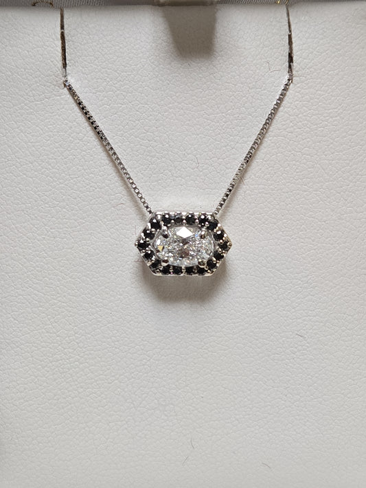 14K white gold pendant with 0.72ct oval lab-created diamond, showcasing elegant jewelry design and craftsmanship.
