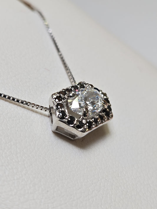 14K white gold pendant featuring a 0.72ct oval lab-created diamond, crafted by Chique Jewelry, with a delicate design.