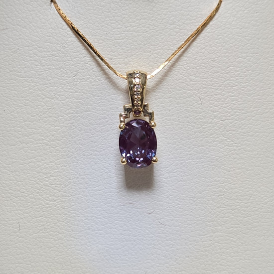 14K gold pendant featuring a 1.35ct oval lab-created alexandrite gemstone, crafted by Chique Jewelry.
