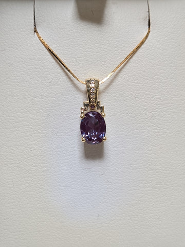 14K gold pendant featuring a 1.35ct oval lab-created alexandrite gemstone, crafted by Chique Jewelry.