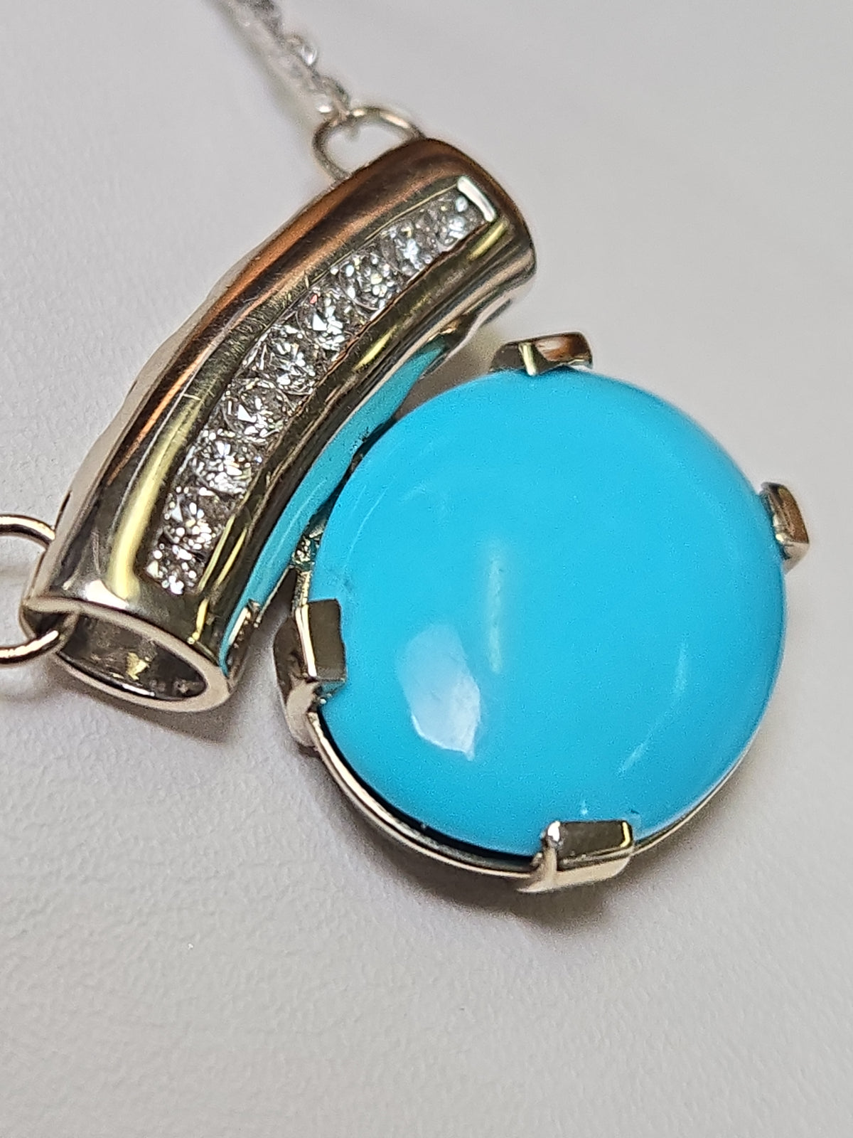 14K white gold cable chain necklace with a turquoise pendant, featuring diamond-cut design, from Chique Jewelry.