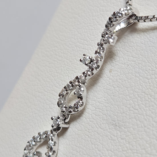 18K white gold pendant with a 0.41ct round diamond, featuring elegant design, weighing 1.8 grams, from Chique Jewelry.