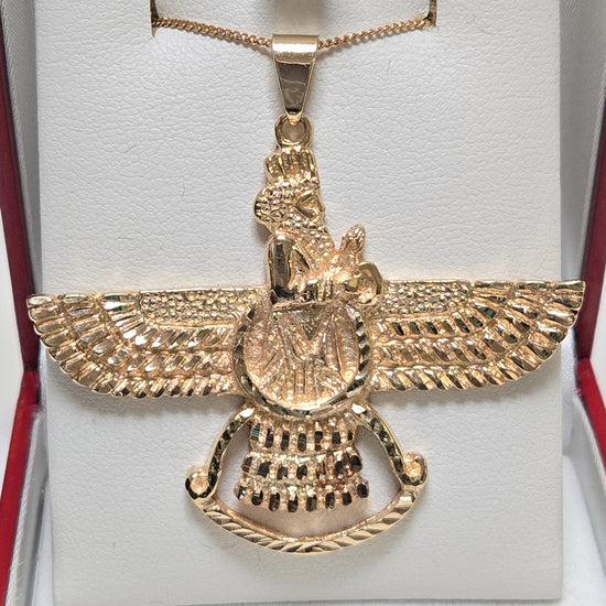 18K gold Farvahar pendant from Chique Jewelry, showcasing intricate design and craftsmanship in a detailed jewelry image.