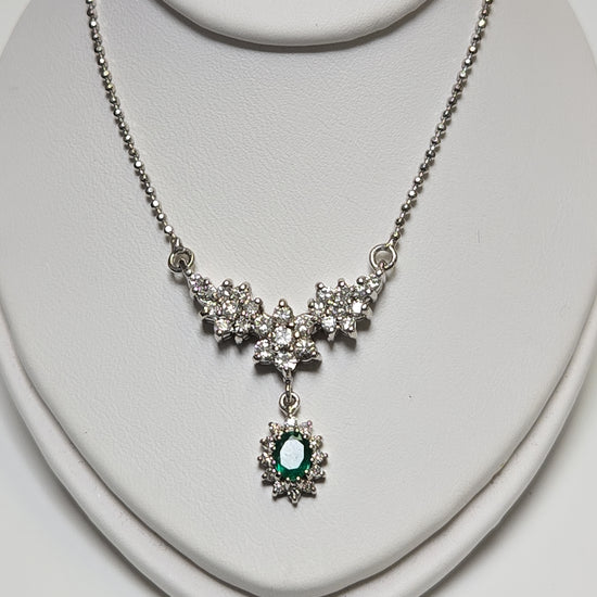 14K white gold bead chain necklace with 0.35ct oval emerald pendant, 16-inch length, from Chique Jewelry.