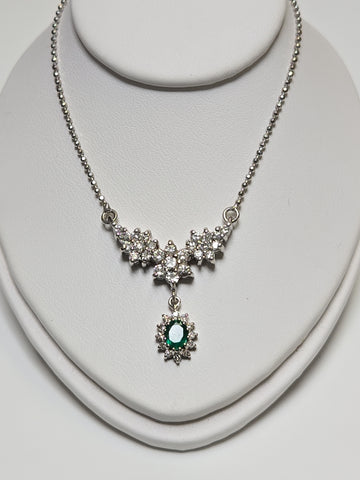 14K white gold bead chain necklace with 0.35ct oval emerald pendant, 16-inch length, from Chique Jewelry.