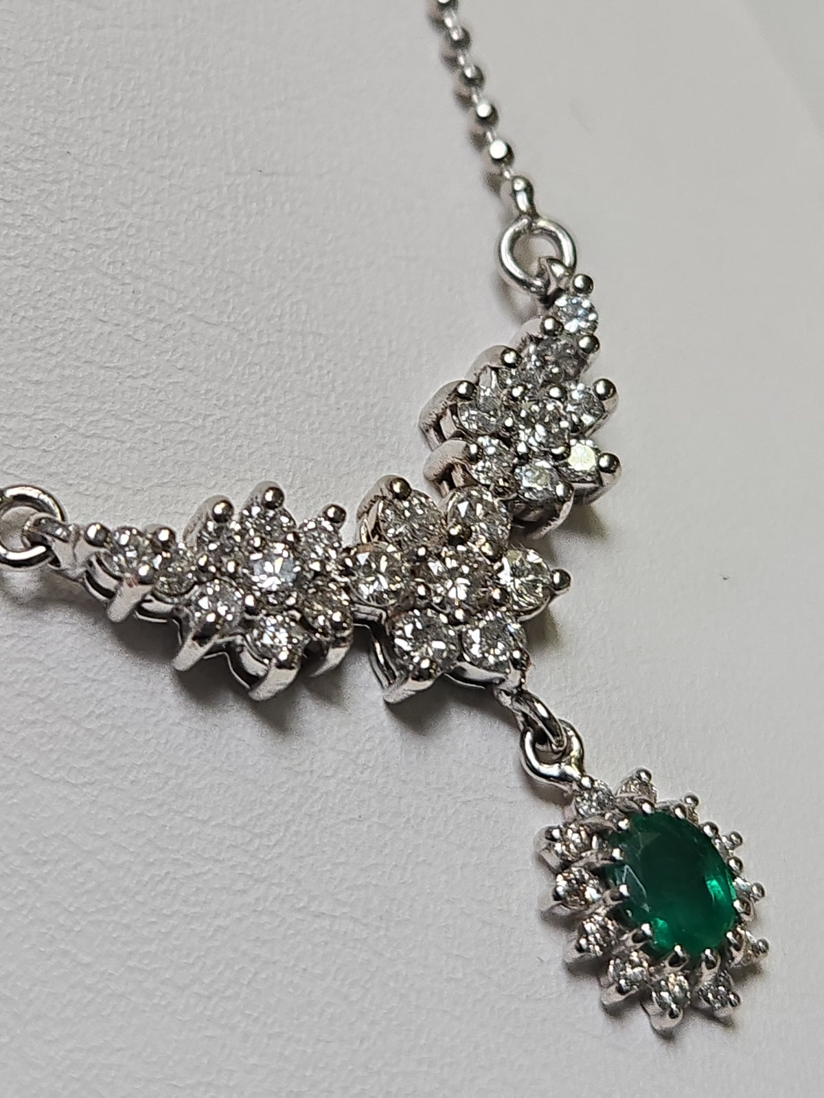14K white gold bead chain necklace with 0.35ct oval emerald pendant, 16-inch length, by Chique Jewelry.