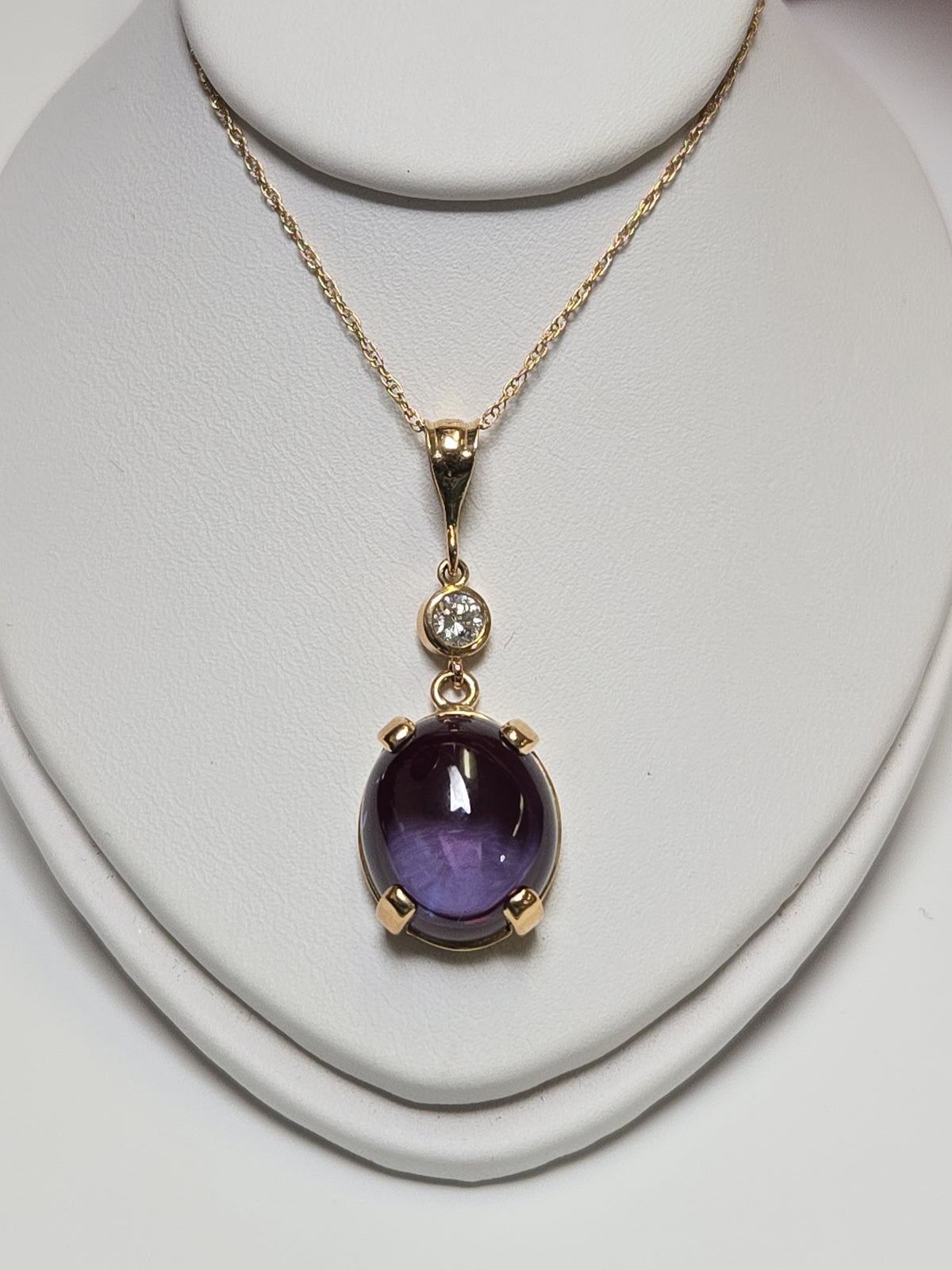 14K gold baby rope chain necklace with 13.08ct lab-created alexandrite pendant, weighs 5.1 grams, from Chique Jewelry.