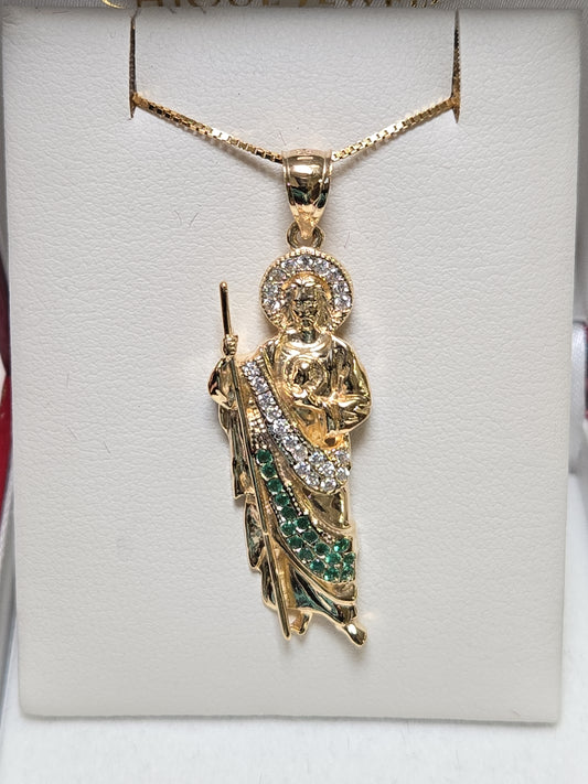 14K gold Jesus pendant with round cubic zirconia, showcasing detailed religious jewelry from Chique Jewelry.