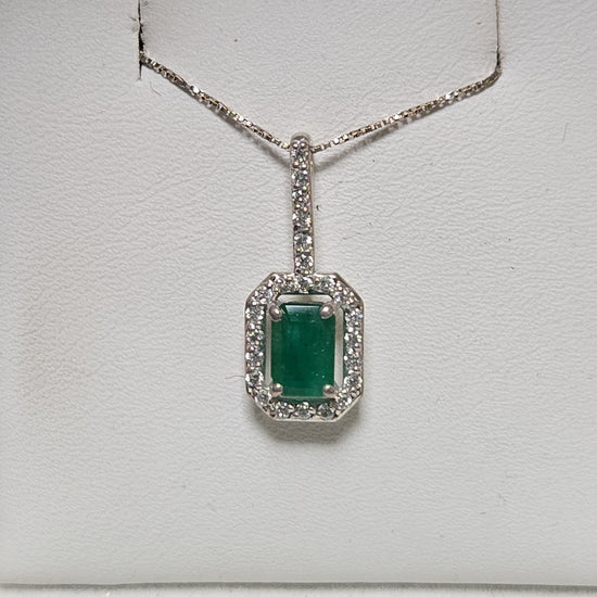 14K white gold pendant featuring a 0.75ct emerald-cut emerald gemstone, weighing 1.1 grams, by Chique Jewelry.