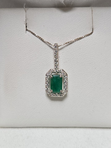 14K white gold pendant featuring a 0.75ct emerald-cut emerald gemstone, weighing 1.1 grams, by Chique Jewelry.