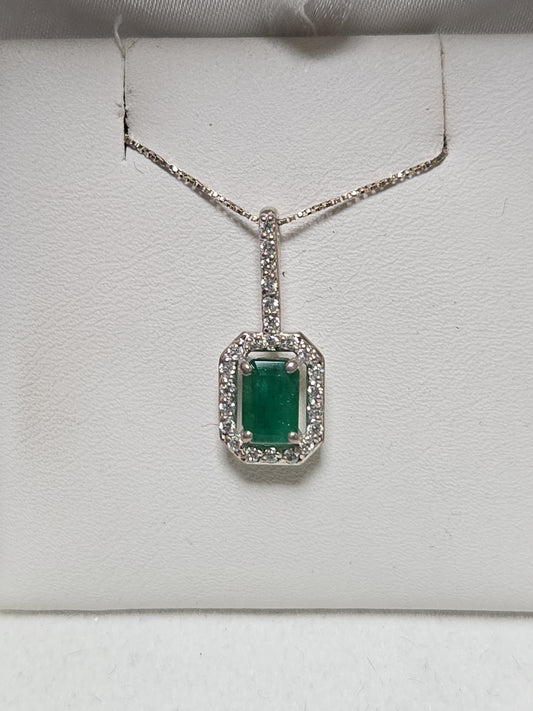 14K white gold pendant featuring a 0.75ct emerald-cut emerald gemstone, weighing 1.1 grams, by Chique Jewelry.