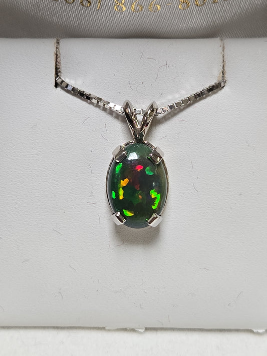 14K white gold oval opal pendant featuring a polished design, weighing 2 grams, by Chique Jewelry.