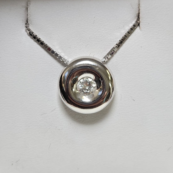 18K white gold pendant with a 0.25ct round diamond, showcasing elegant jewelry design with sparkling gemstone accents.