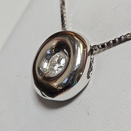 18K white gold pendant with a 0.25ct round diamond, featuring a sleek design from Chique Jewelry.