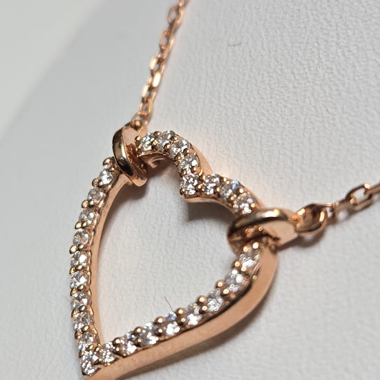 14K rose gold heart pendant necklace with lab-created diamonds, crafted by Chique Jewelry, showcasing a delicate, elegant design.