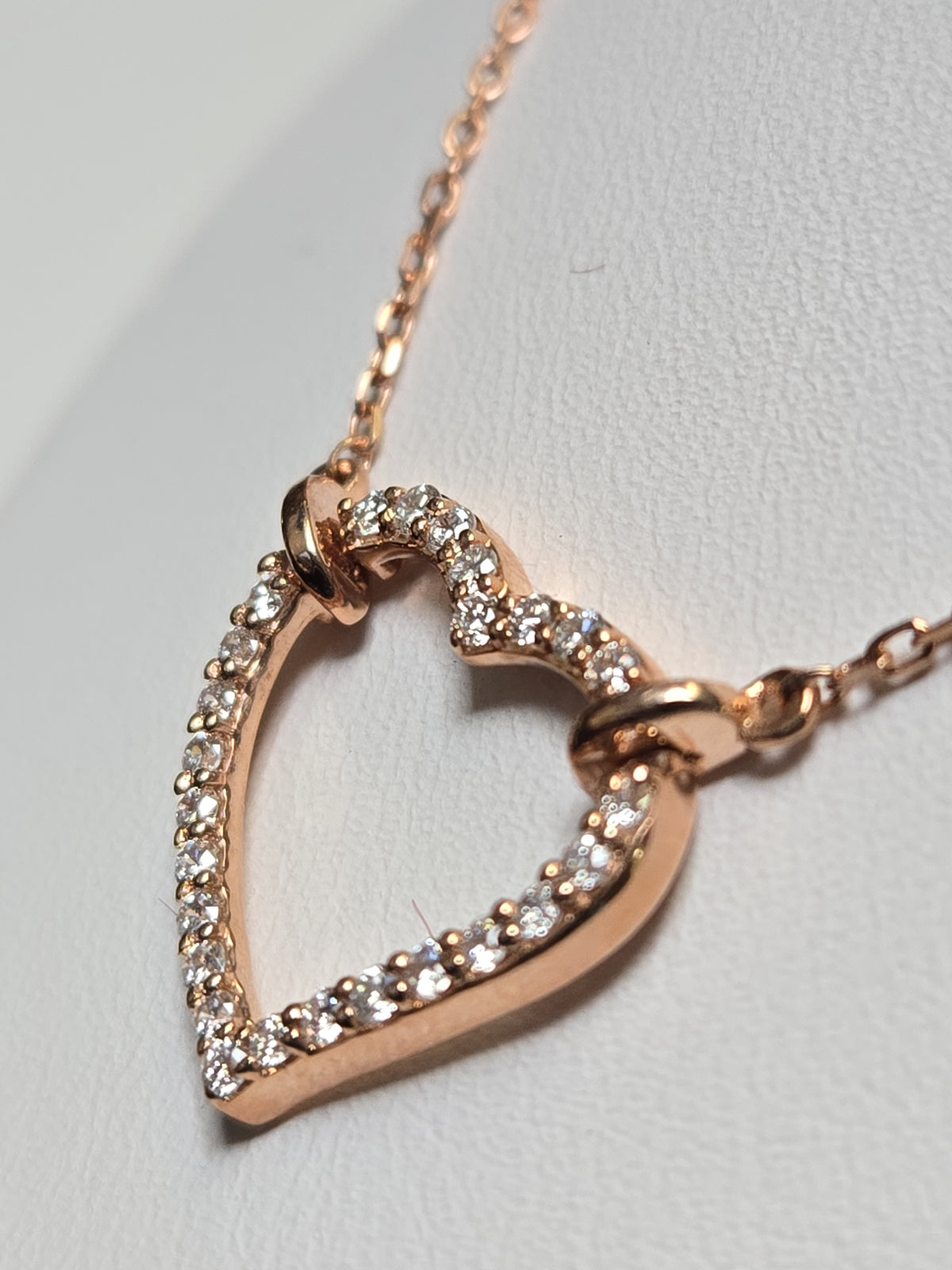 14K rose gold heart pendant necklace with lab-created diamonds, crafted by Chique Jewelry, showcasing a delicate, elegant design.