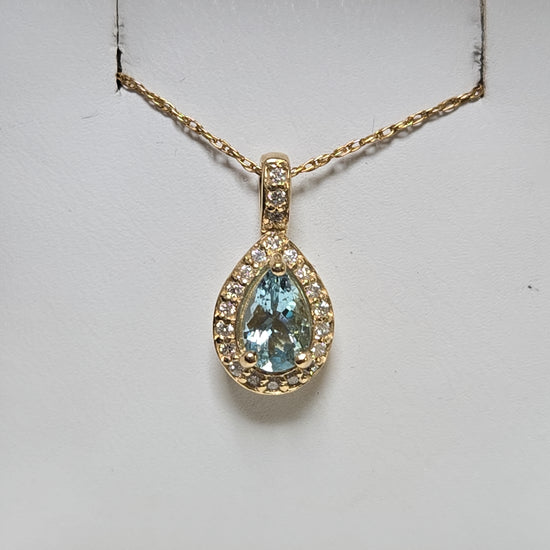 14K gold pendant featuring a 0.78ct pear-shaped aquamarine, displayed with a delicate chain, from Chique Jewelry.