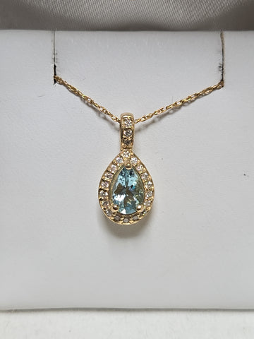 14K gold pendant featuring a 0.78ct pear-shaped aquamarine, displayed with a delicate chain, from Chique Jewelry.