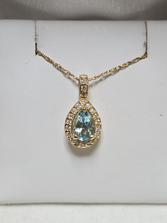 14K gold pendant featuring a 0.78ct pear-shaped aquamarine, displayed with a delicate chain, from Chique Jewelry.