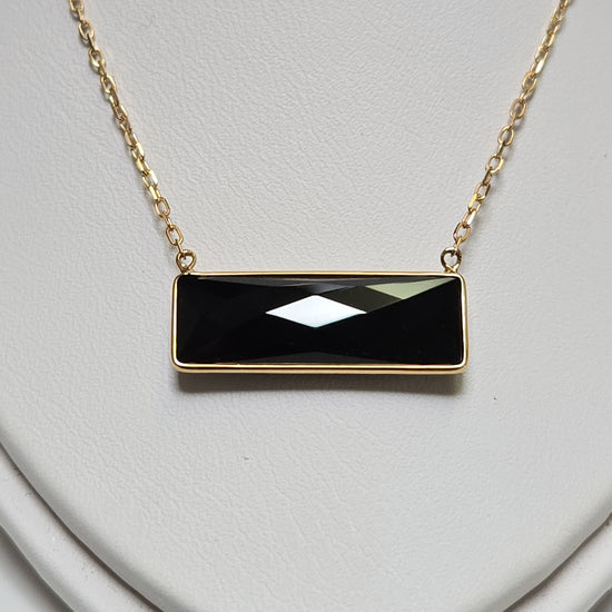 14K gold diamond cut cable chain necklace with rectangular black onyx pendant, weighing 2.7 grams, by Chique Jewelry