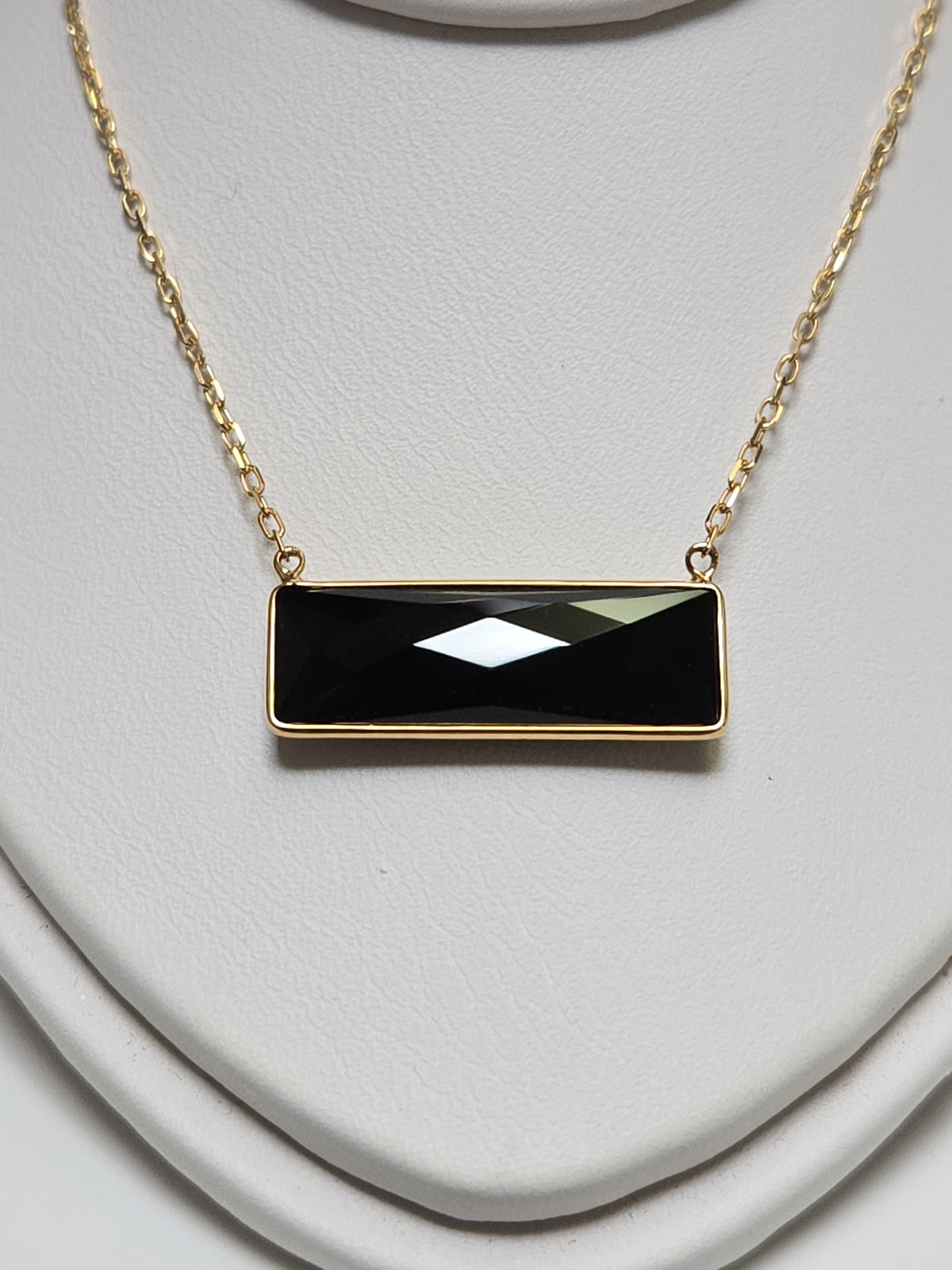 14K gold diamond cut cable chain necklace with rectangular black onyx pendant, weighing 2.7 grams, by Chique Jewelry