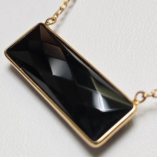 14K gold diamond cut cable chain necklace with rectangular black onyx pendant, crafted by Chique Jewelry, weighs 2.7 grams.