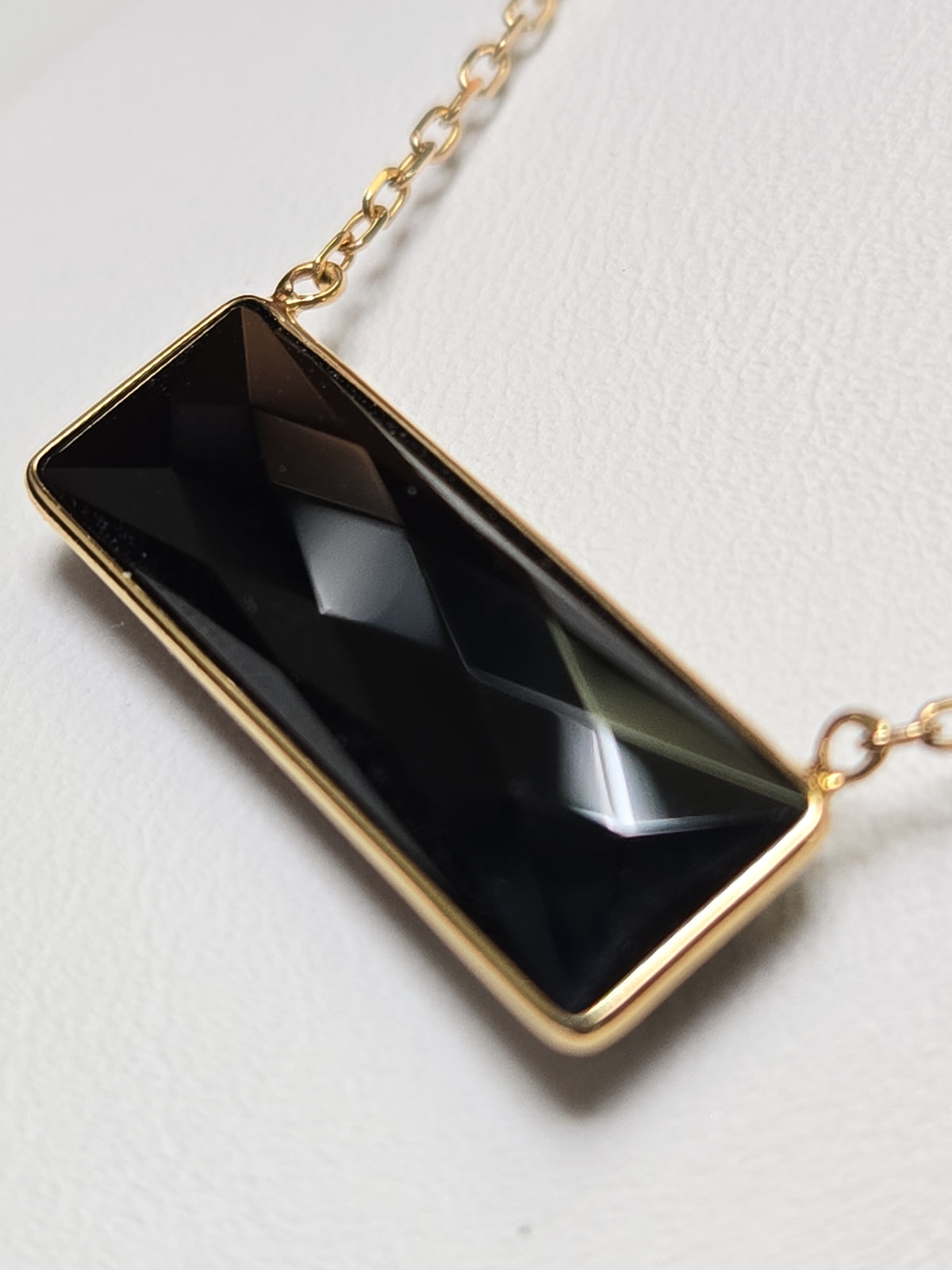 14K gold diamond cut cable chain necklace with rectangular black onyx pendant, crafted by Chique Jewelry, weighs 2.7 grams.
