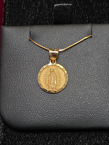 14K gold Mary pendant by Chique Jewelry, featuring a detailed religious figure design, weighs 1.1 grams.