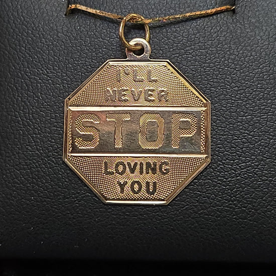 14K gold love pendant from Chique Jewelry featuring a heart-shaped design, weighing 1.6 grams.