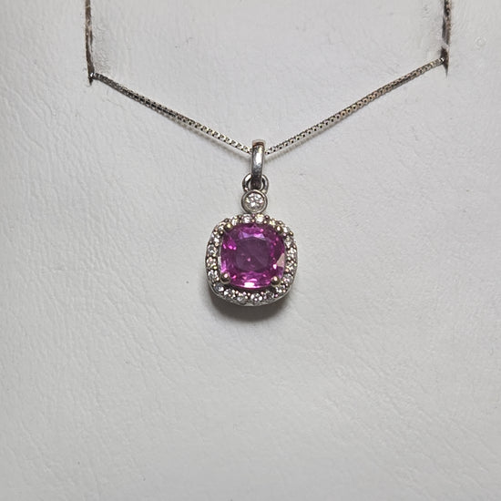 14K white gold pendant with a 1.05ct cushion-cut pink sapphire, showcasing elegant jewelry craftsmanship.