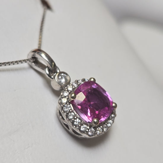 14K white gold pendant with 1.05ct cushion pink sapphire and 1.4g weight, featuring elegant jewelry craftsmanship.
