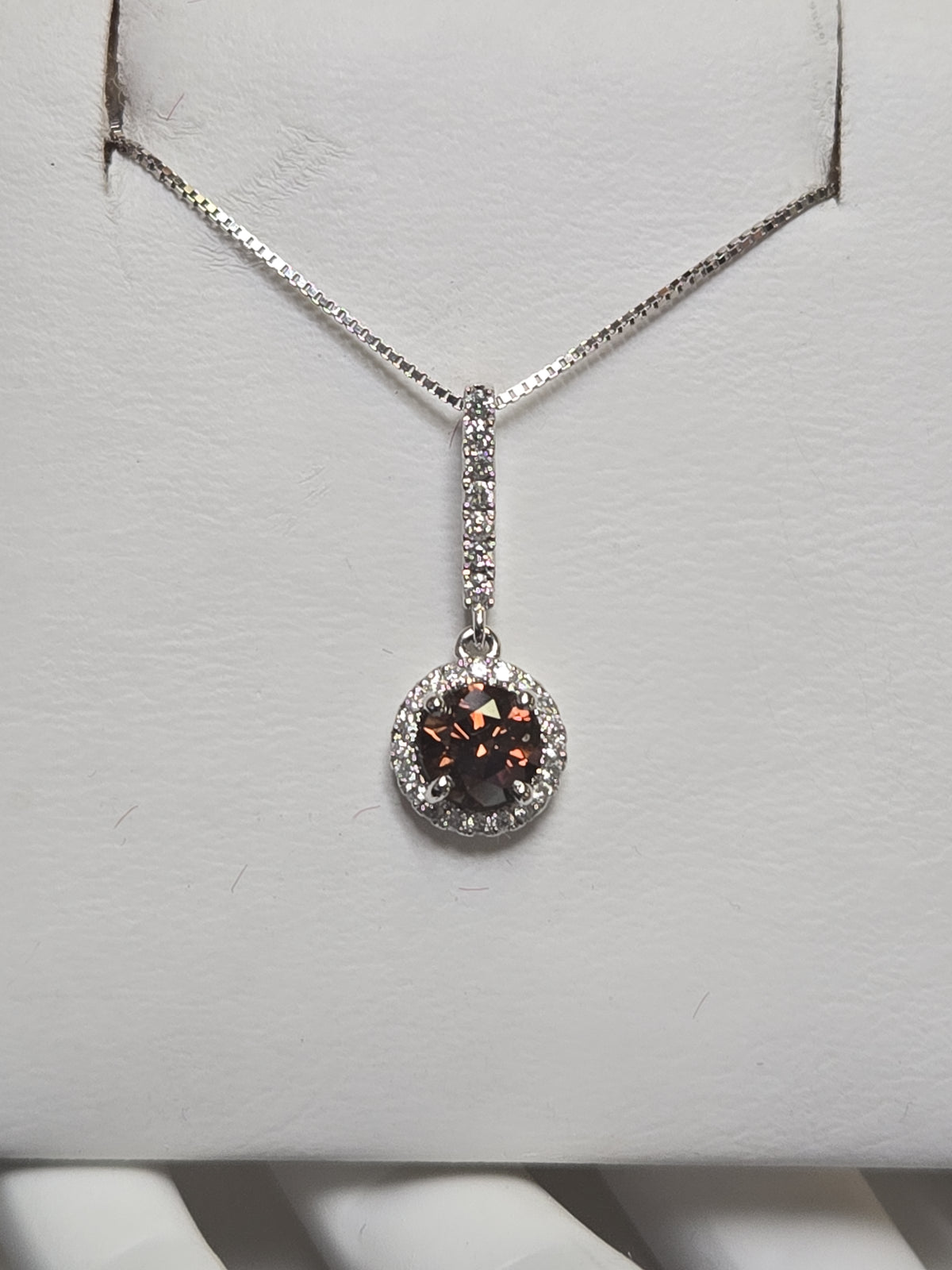 14K white gold pendant featuring a 0.71ct round chocolate diamond, crafted by Chique Jewelry, with a delicate and elegant design.