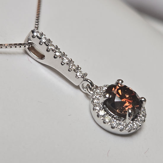 14K white gold pendant featuring a 0.71ct round chocolate diamond, from Chique Jewelry, with a delicate and elegant design.