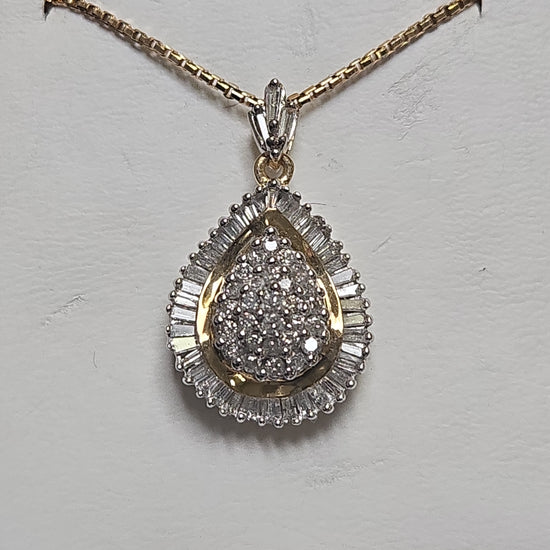 14K multi-tone gold cluster pendant with 1.5ct round diamonds, weighing 5.2g, by Chique Jewelry.