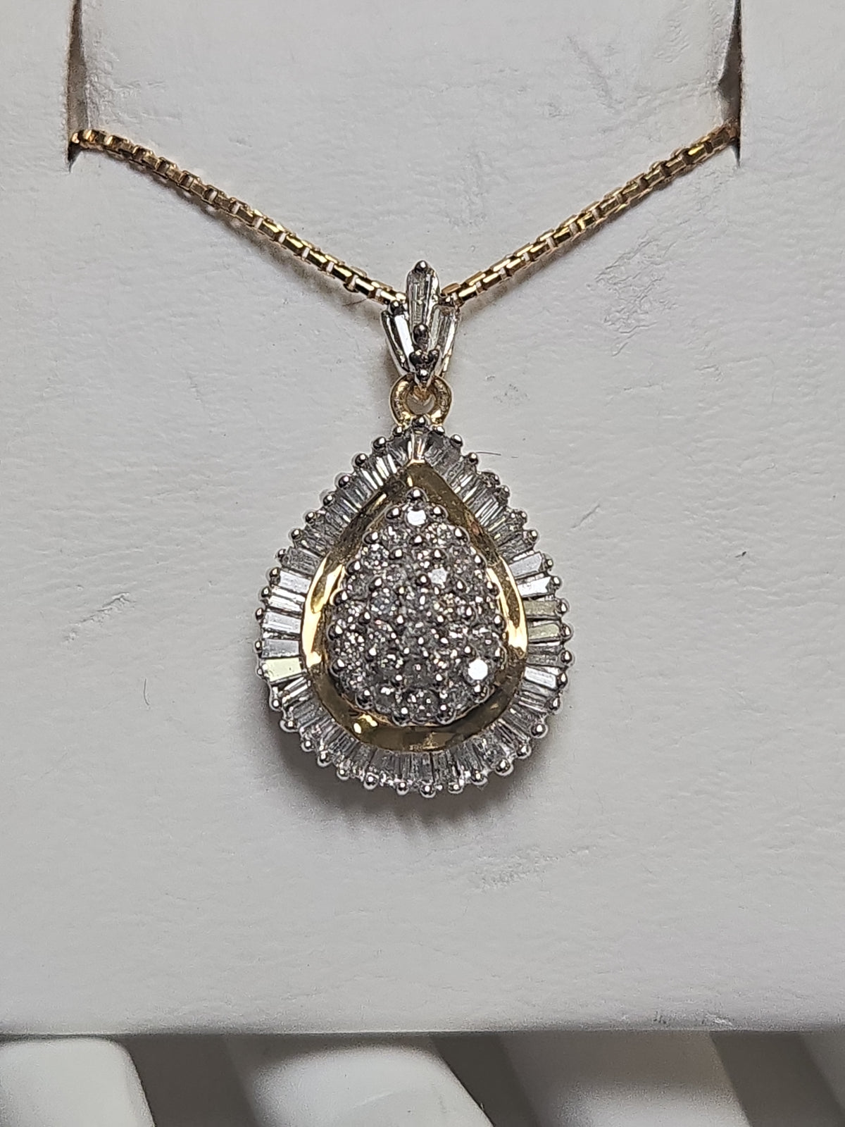 14K multi-tone gold cluster pendant with 1.5ct round diamonds, weighing 5.2g, by Chique Jewelry.
