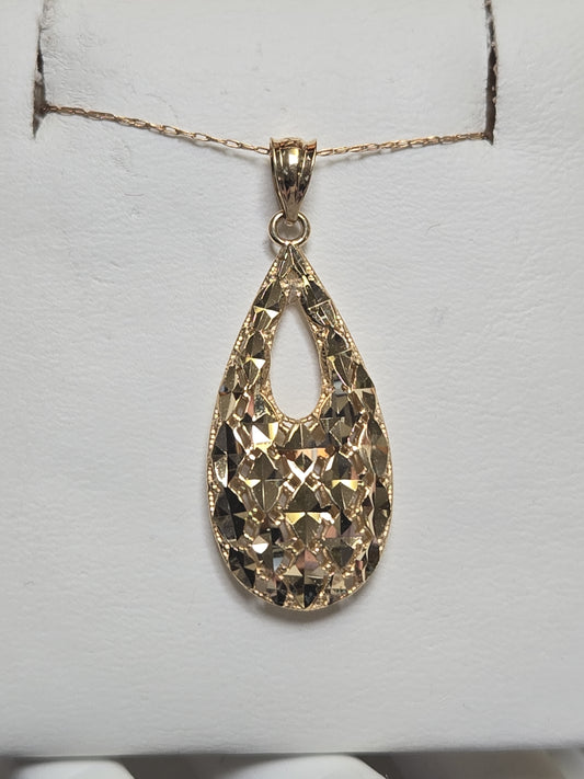 14K gold pendant weighing 2.7 grams from Chique Jewelry with intricate design and polished finish.