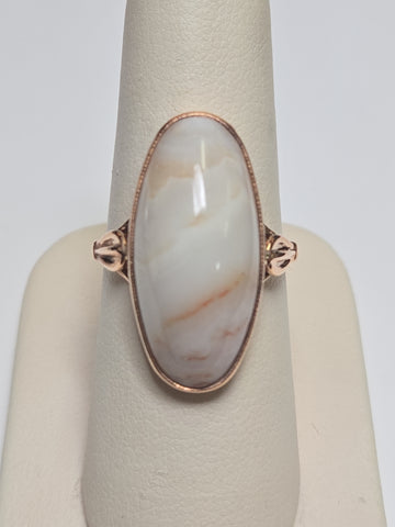 14K rose gold ring featuring an oval agate gemstone, weighing 6.4 grams, from Chique Jewelry.