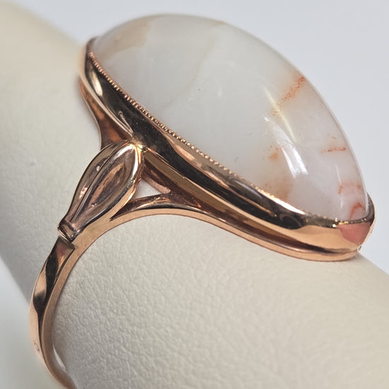 14K rose gold ring with oval agate gemstone from Chique Jewelry, showcasing elegant design and polished finish.