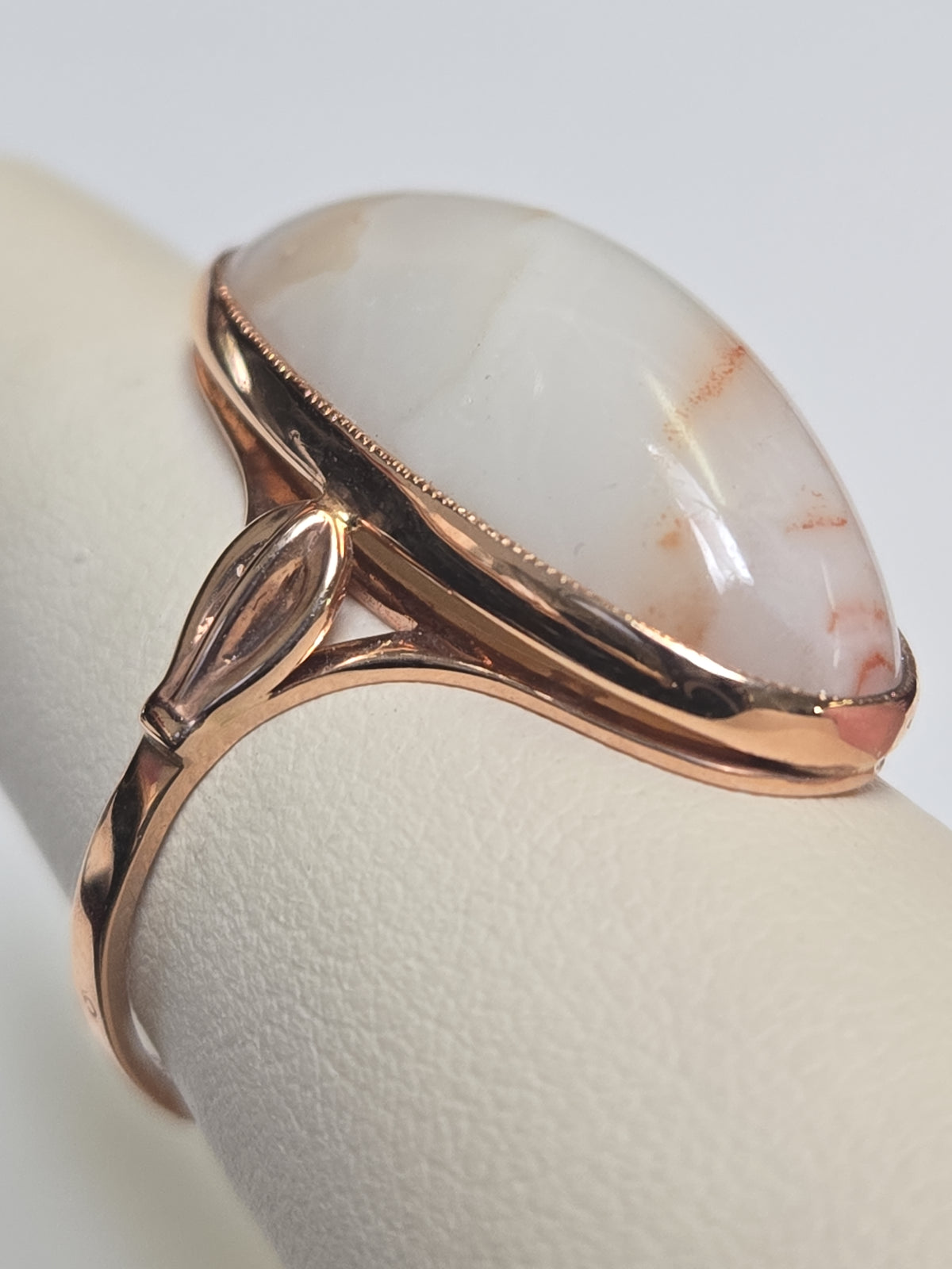 14K rose gold ring with oval agate gemstone from Chique Jewelry, showcasing elegant design and polished finish.