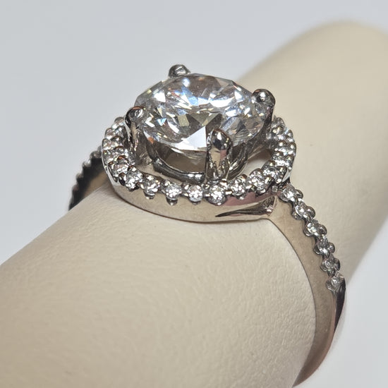18K white gold ring featuring a 2.07ct round lab-created diamond, elegant jewelry piece with a sleek design.
