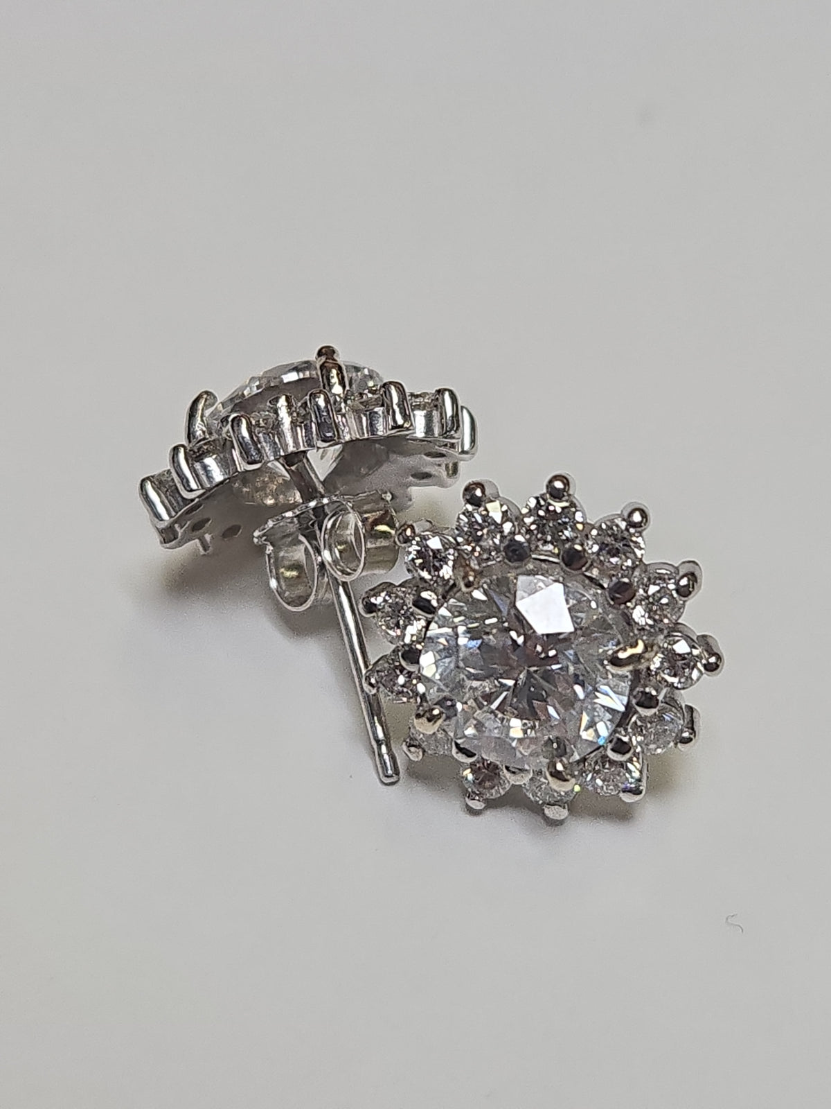 14K white gold stud earrings with 3ct round lab-created diamonds, featuring a secure post and butterfly backing.