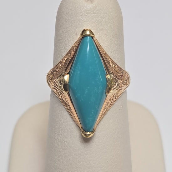 18K gold ring featuring a marquise turquoise gemstone, crafted by Chique Jewelry, weighing 4.1 grams.